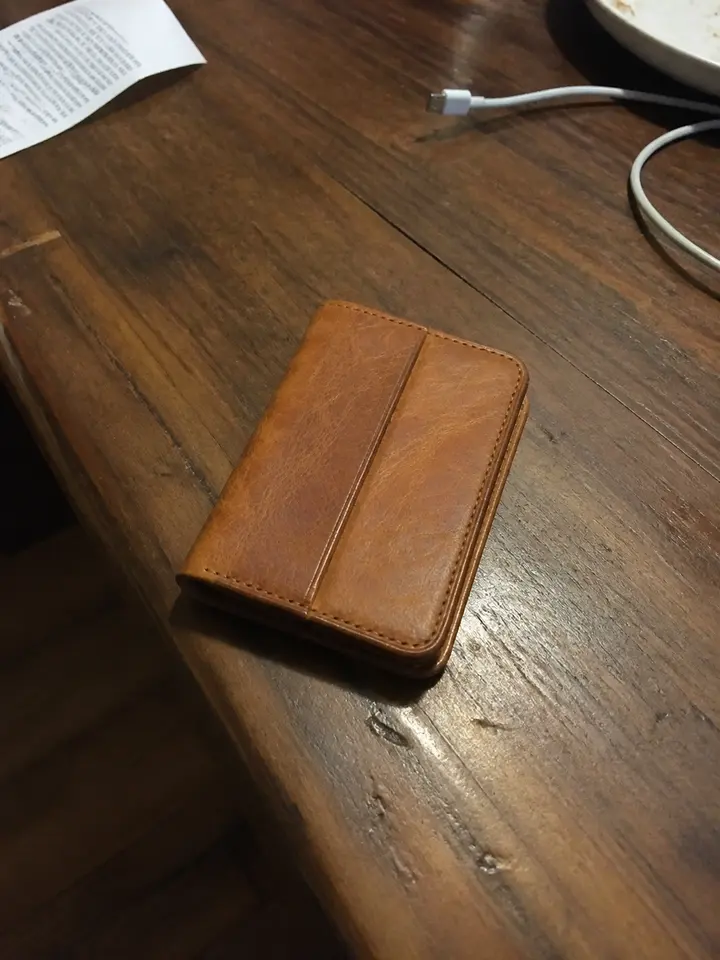 Casual source photo of a leather wallet