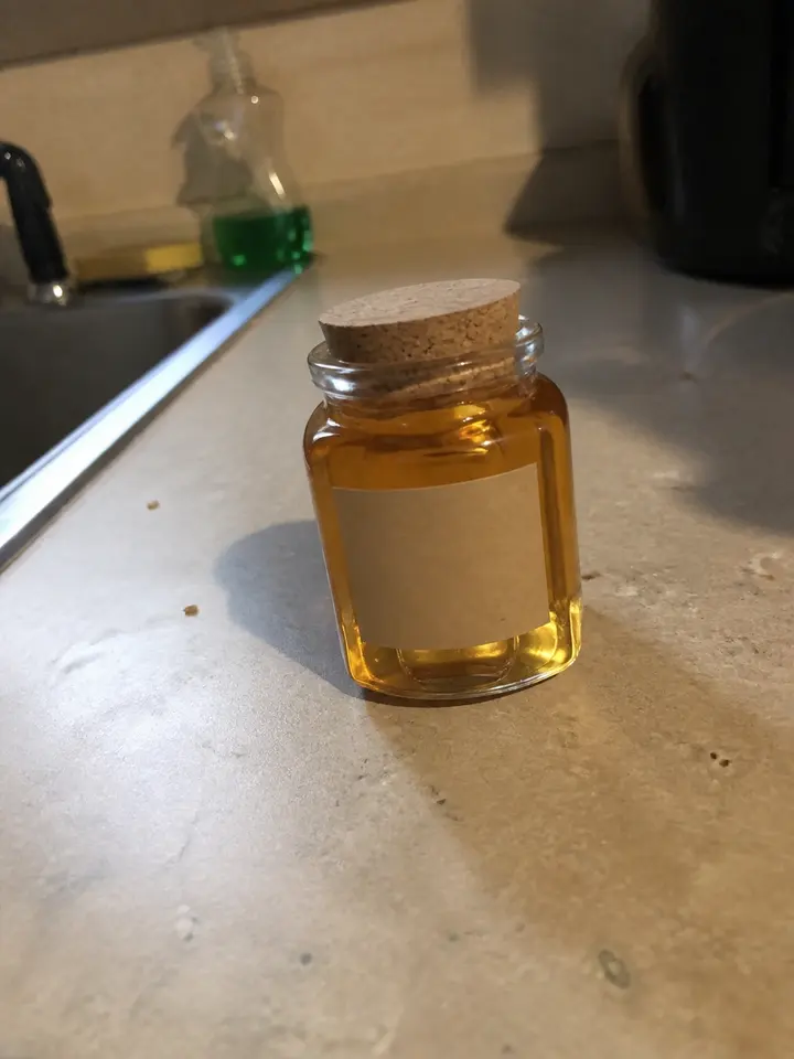 Casual source photo of a honey jar
